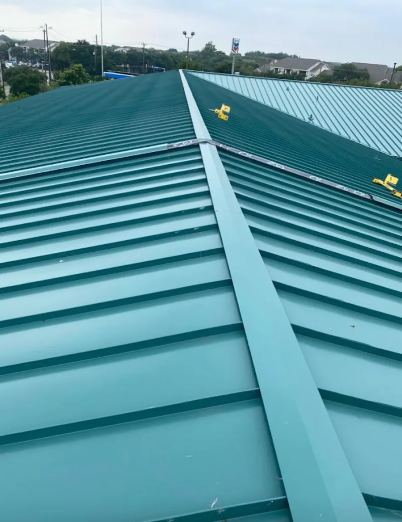 Green commercial metal roof ridge and valley for Metal Roof Repair in Roxbury